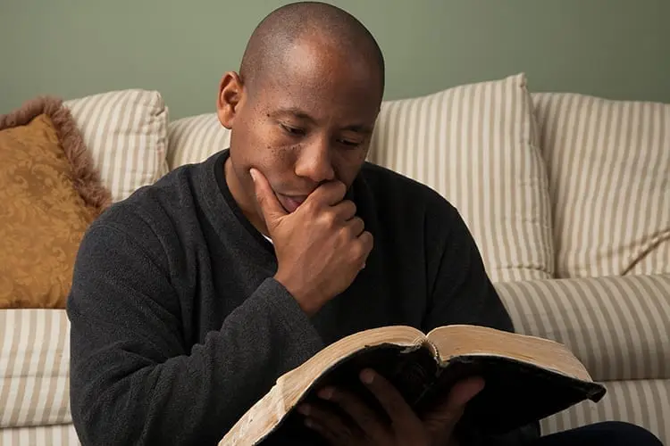 Man Studying the Bible